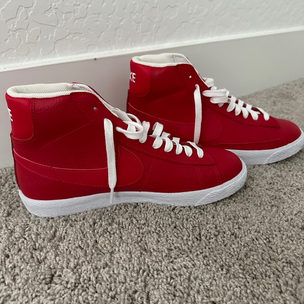 New never worn red Nike high tops